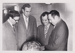 Four Men Looking at a Globe by Cedarville University