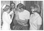 Don Callan, Nurse, & Unidentified Students by Cedarville University