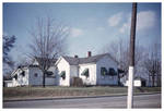 White Home with Green Awnings by Cedarville University